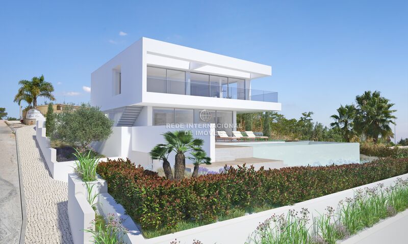 Moradia nova em construção V3 Luz Lagos - alarme, caldeira, piscina, bbq, jardim, garagem, ar condicionado, terraço, vidros duplos