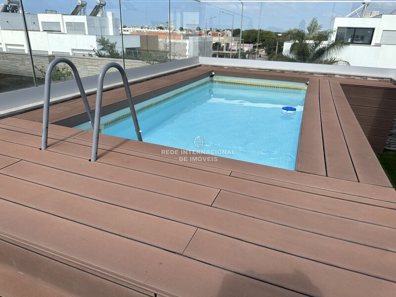 House 3+1 bedrooms Luxury Pechão Olhão - double glazing, solar panels, air conditioning, alarm, sea view, barbecue, swimming pool, store room, terrace, garage