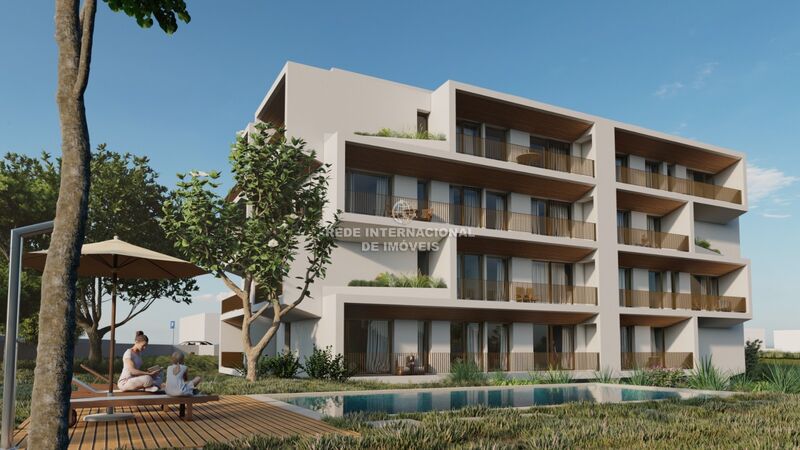 Apartamento T2 Moderno em construção Montenegro Faro - ar condicionado, varanda, cozinha equipada, vidros duplos, piscina, aquecimento central, isolamento térmico, garagem, condomínio privado, painéis solares, jardim