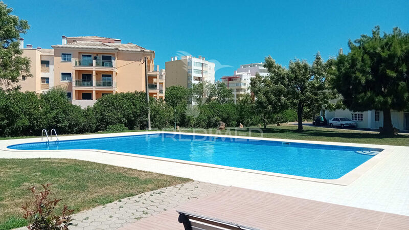 Apartment 2 bedrooms Portimão - swimming pool, gated community, balcony, fireplace, garden, kitchen