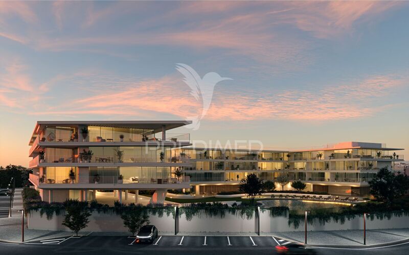 Apartamento em construção T2 Quarteira Loulé - videovigilância, ténis, varanda, ar condicionado, jardins, piscina, cozinha equipada, alarme