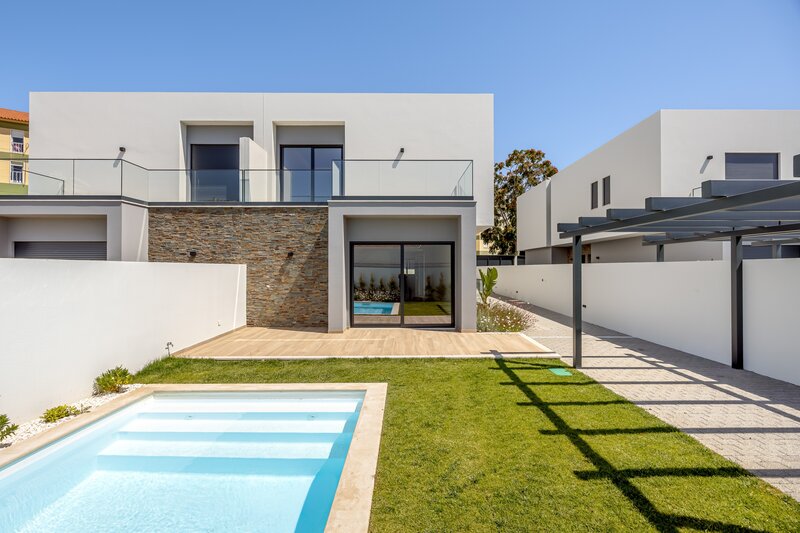 House Modern 3+1 bedrooms Carcavelos Cascais - terrace, plenty of natural light, garage, balconies, store room, green areas, swimming pool, parking lot, solar panels, garden, alarm, air conditioning
