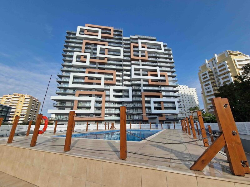 Apartamento T2 de luxo com vista mar Praia da Rocha Portimão - cozinha equipada, varanda, vista mar, chão radiante, ar condicionado, piscina