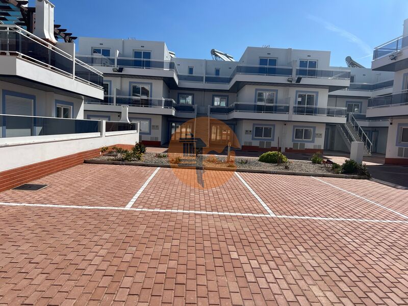 Apartamento novo T1 Vila Nova de Cacela Vila Real de Santo António - garagem, ar condicionado, zonas verdes, painéis solares, condomínio privado, piscina, cozinha equipada, parqueamento
