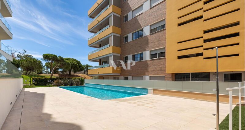 Apartment in the center T3 Quarteira Loulé - garage, store room, air conditioning, double glazing, equipped, gated community, solar panels, terrace, swimming pool, thermal insulation